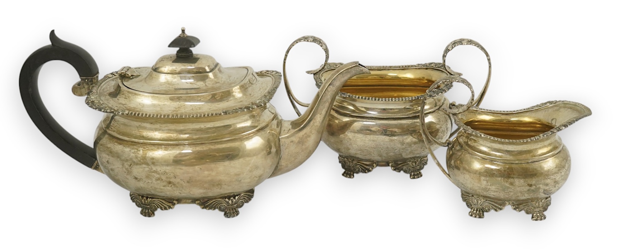 A George V silver three piece tea set by Edward Barnard & Sons Ltd